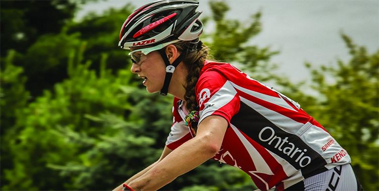 Hailey Smith riding a bike in a race