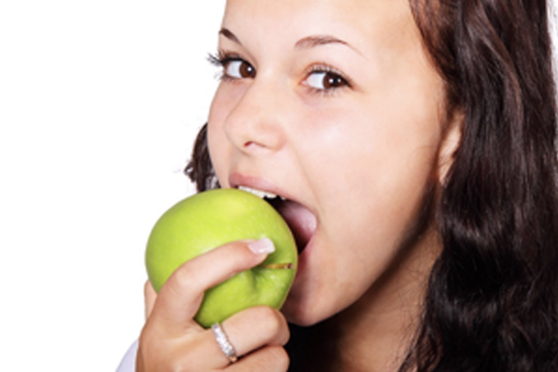 Woman eating apple