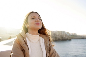 Woman Breathing Outside 